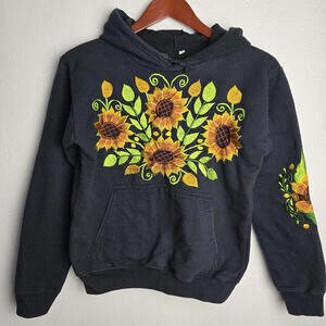 Black hooded sweatshirt with an embroidered sunflower design on the front and on
